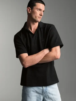 Oversized Poloshirt ohne Knopfleiste in Waffeloptik Schwarz