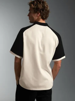 Poloshirt mit Raglanärmeln und trigema Brustpatch Natur